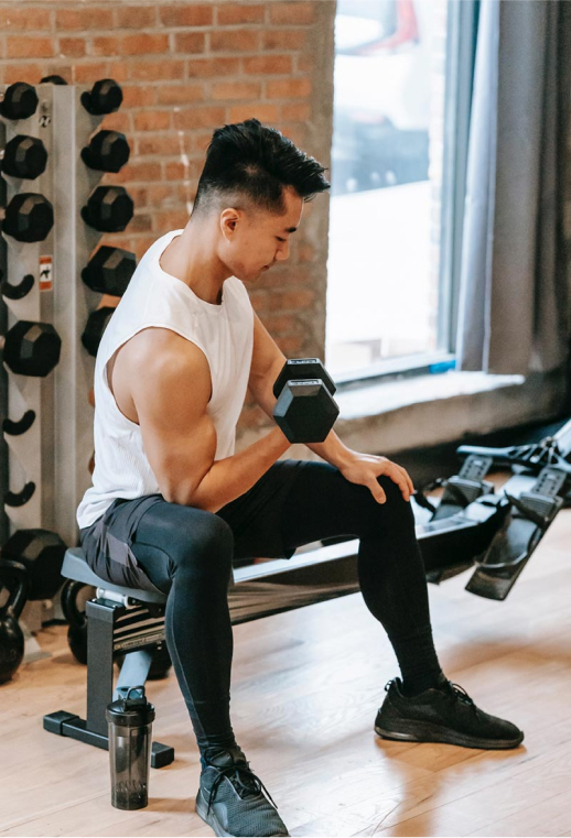 Man doing biceps exercise with dumbbell